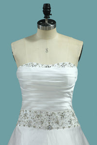 2024 Satin Wedding Dress Strapless A Line With Beads And Ruffles Chapel Train